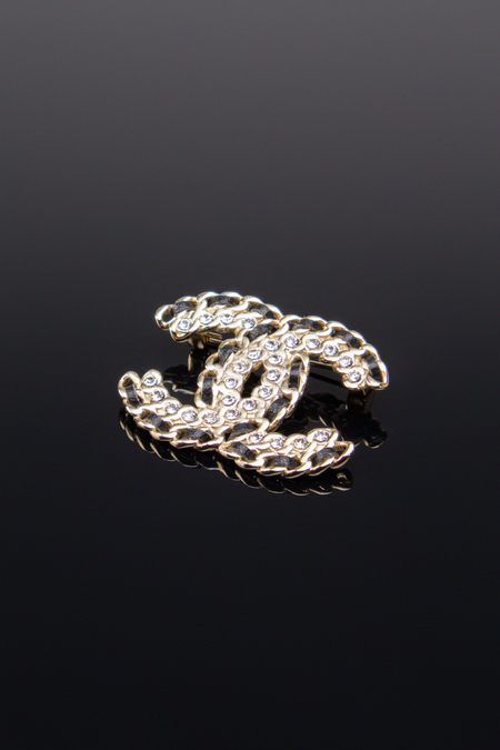 Брошь черные вставки камни золото 034116